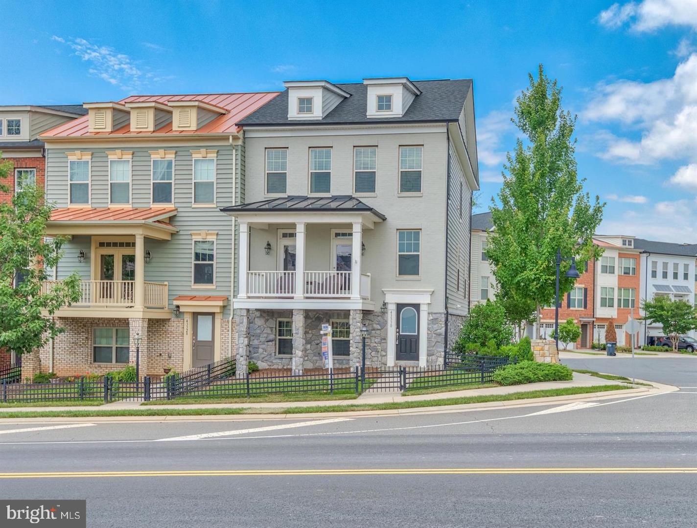 a view of a brick building next to a yard