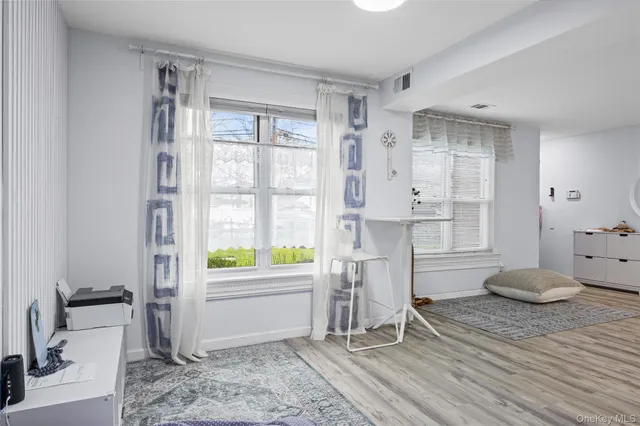 a room with walk in closet and a window