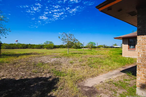 a view of a yard with an ocean beach
