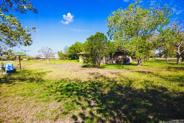 a view of a yard with an outdoor space