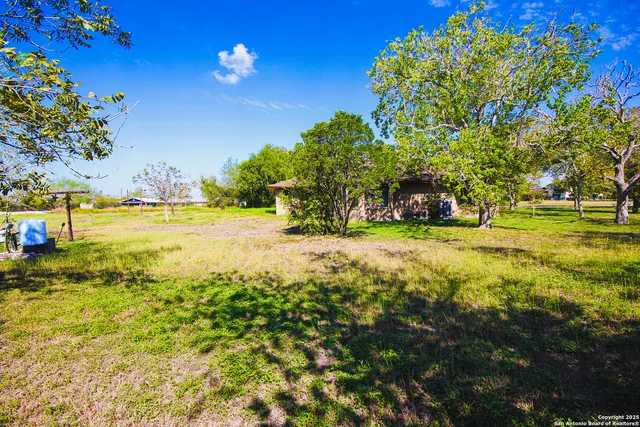 a view of a yard with an outdoor space