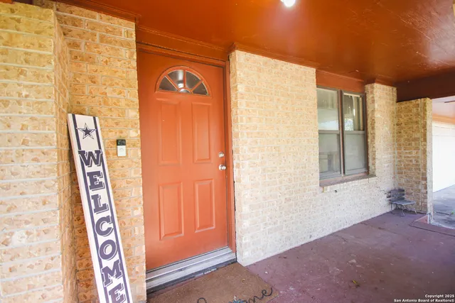 a view of an entryway with a door