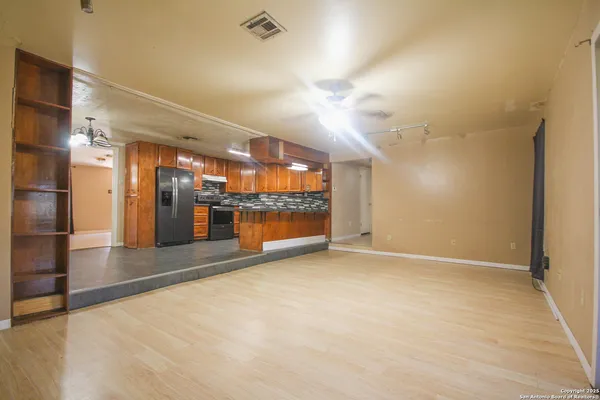 an empty room with large windows