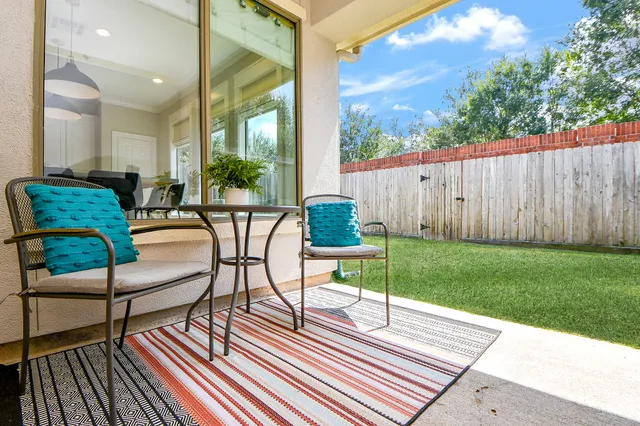 a view of a chairs and table in the patio