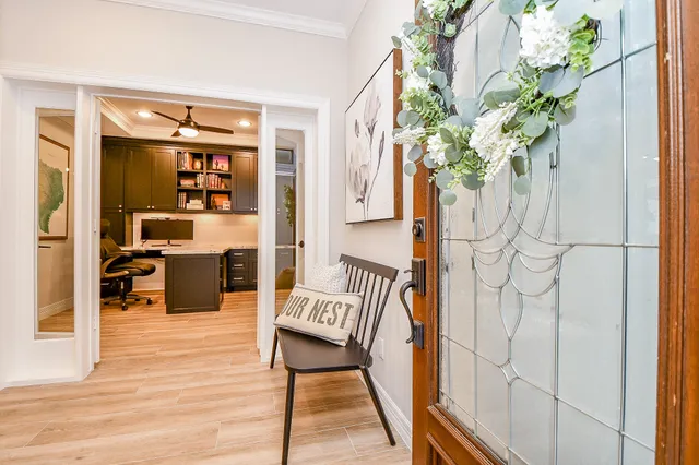 a balcony with table and chairs