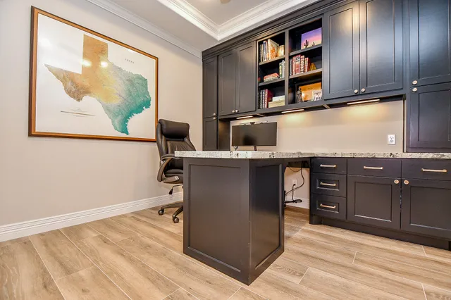 a view of a kitchen with a sink and cabinets