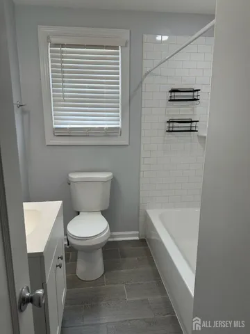 a bathroom with a toilet sink and bathtub