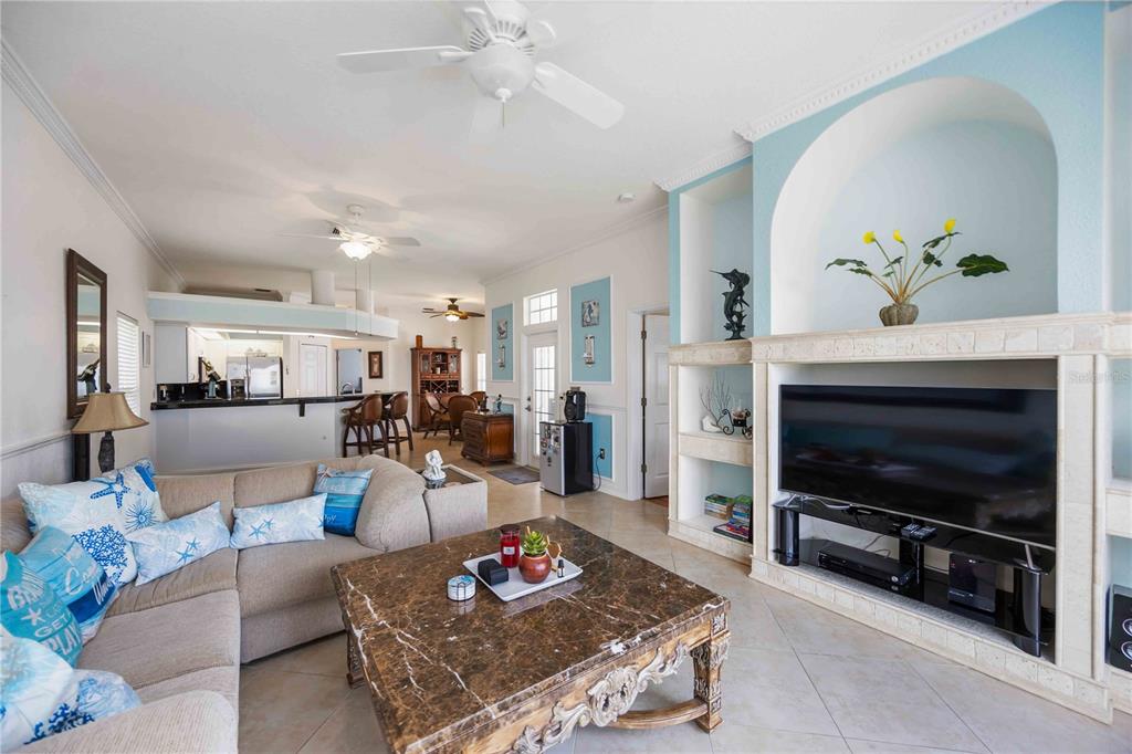 48 Bunker Road Rotonda West, FL 33947 - Photo 14 of 59 a living room with furniture and a flat screen tv