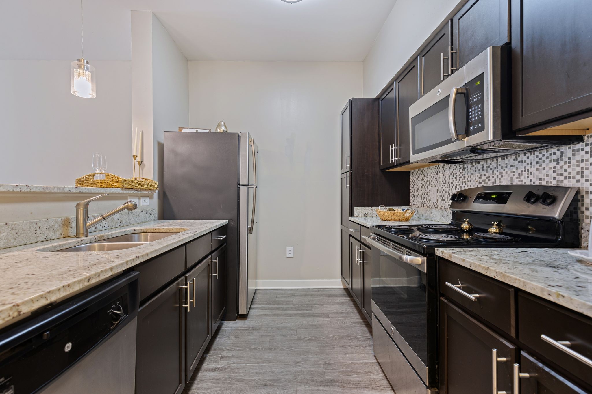 410 Rosedale Avenue, Unit 302 Nashville, TN 37211 - Photo 3 of 13 a kitchen with stainless steel appliances granite countertop a stove a sink and a microwave