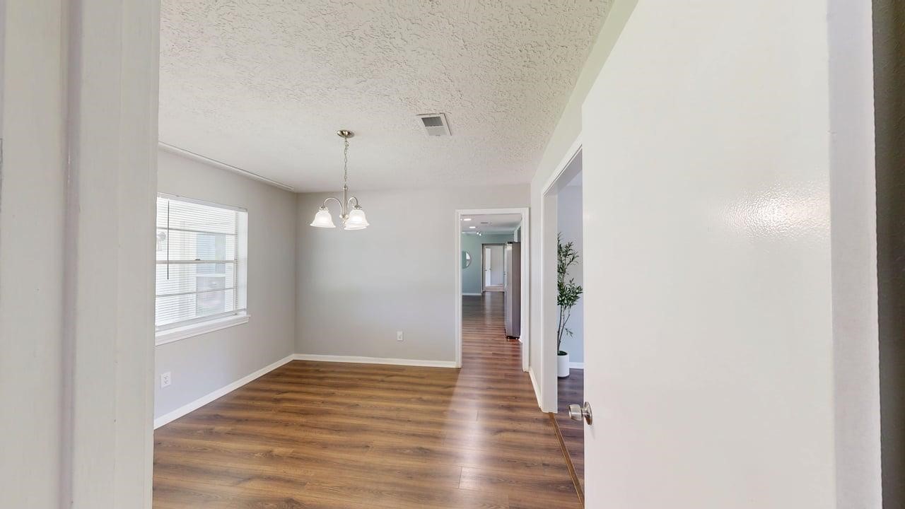619 Cotter Drive Spring, TX 77373 - Photo 32 of 50 a view of an empty room with wooden floor and a window