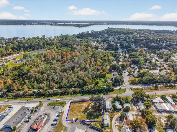 an aerial view of residential building and lake