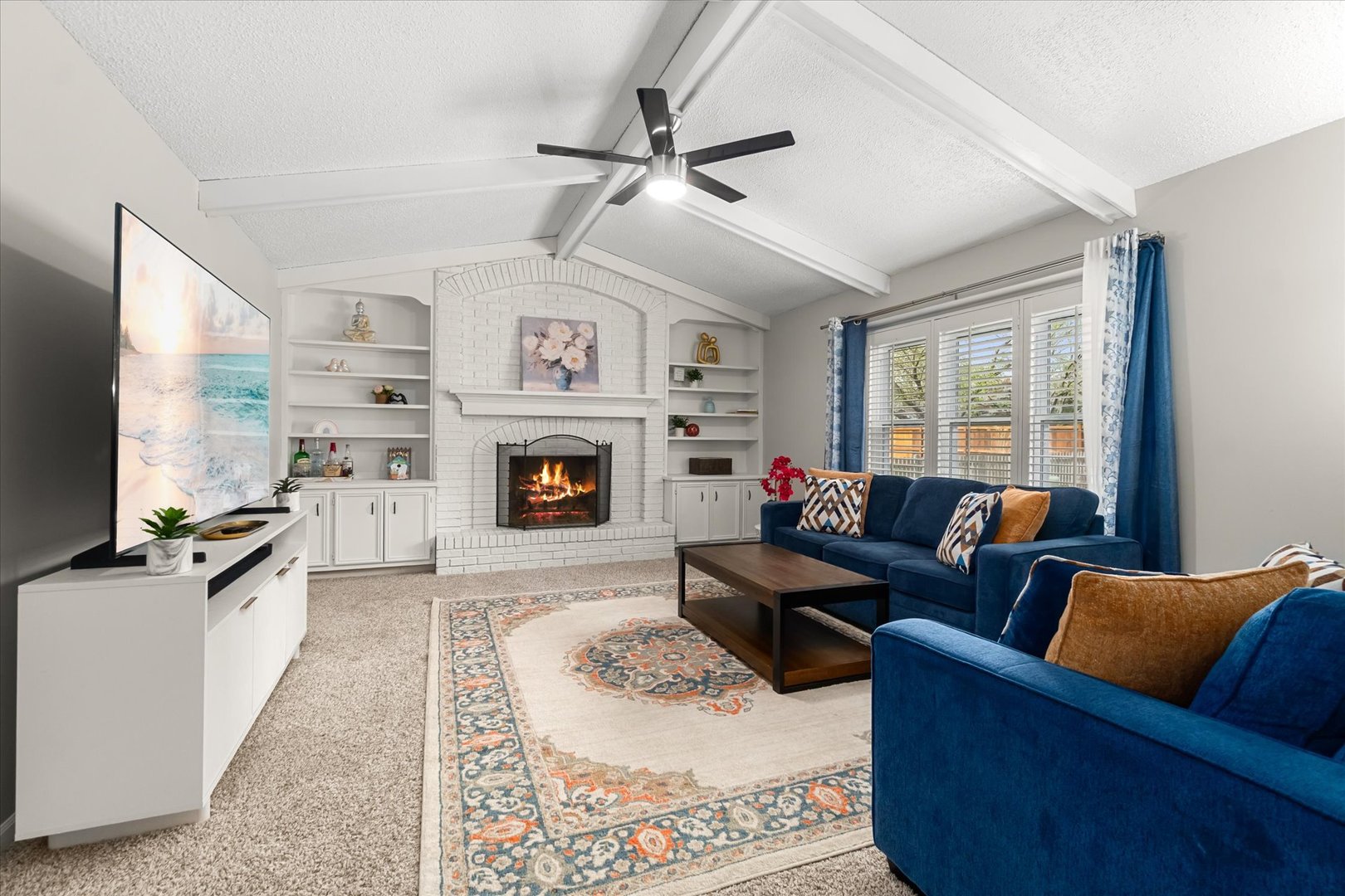1763 Frost Lane Naperville, IL 60564 - Photo 2 of 46 a living room with furniture a fireplace and a flat screen tv