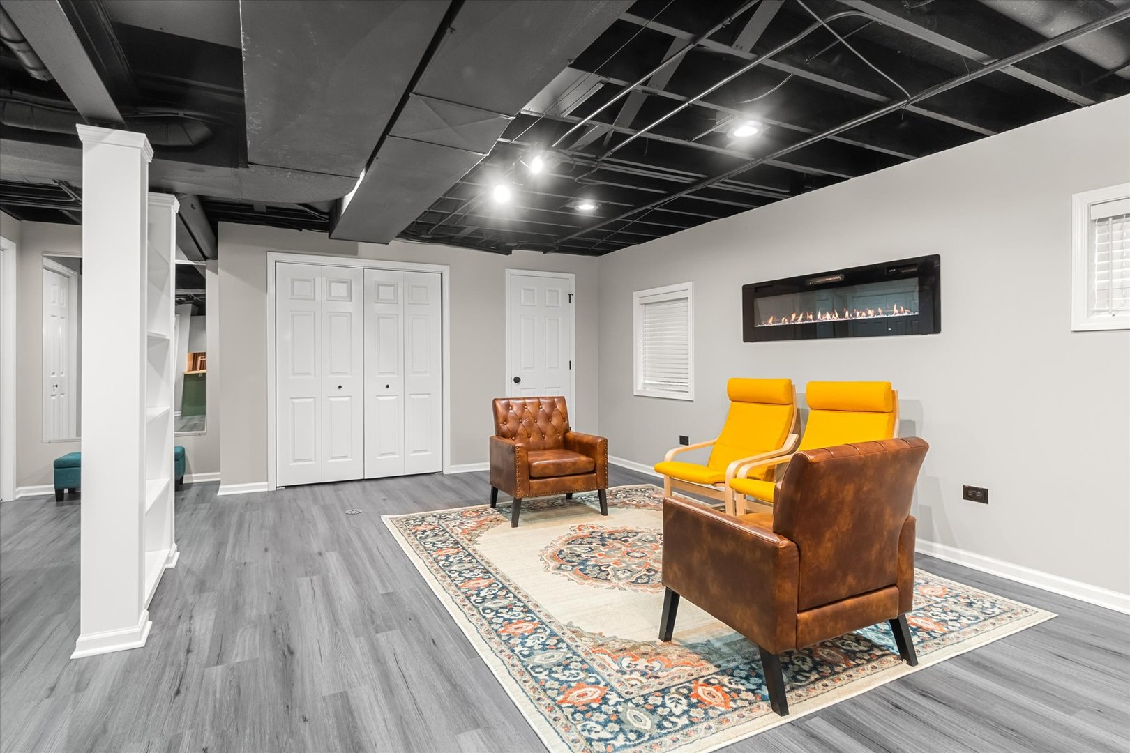 1763 Frost Lane Naperville, IL 60564 - Photo 24 of 46 a living room with furniture and a flat screen tv
