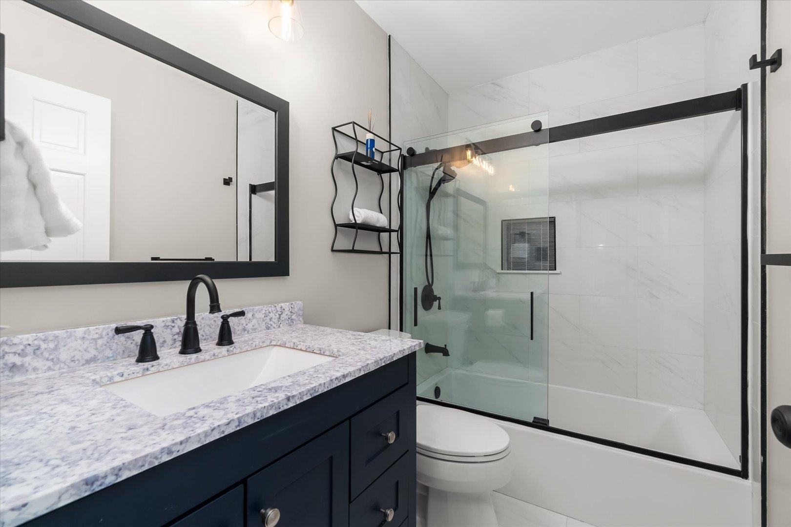 1763 Frost Lane Naperville, IL 60564 - Photo 5 of 46 a bathroom with a granite countertop sink mirror toilet and shower
