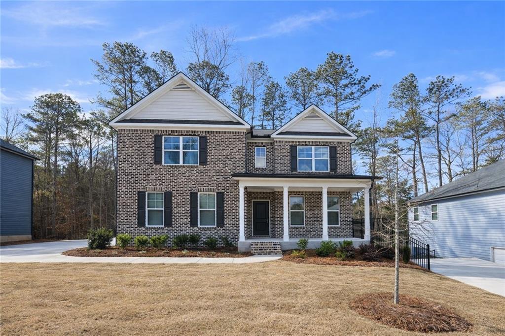 front view of a house with a yard