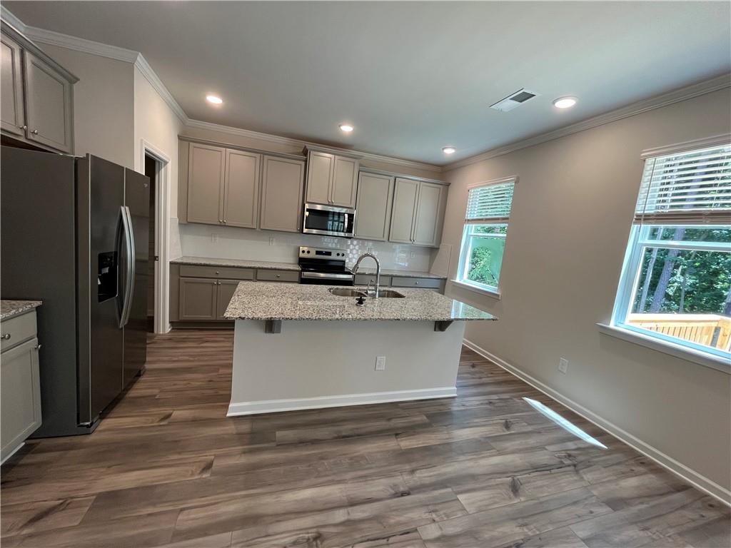 4524 Ajo Walk Atlanta, GA 30331 - Photo 16 of 40 a kitchen with stainless steel appliances granite countertop a refrigerator sink and microwave