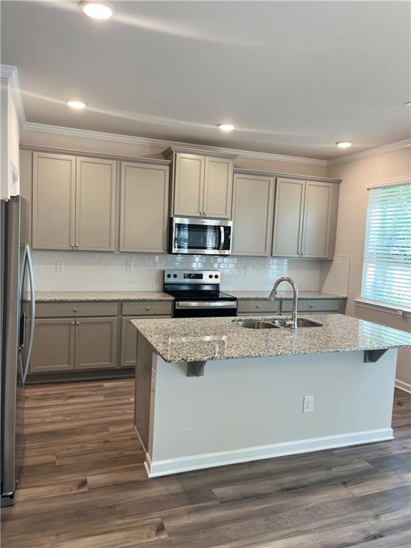 4524 Ajo Walk Atlanta, GA 30331 - Photo 25 of 40 a kitchen with stainless steel appliances granite countertop a sink a stove and cabinets