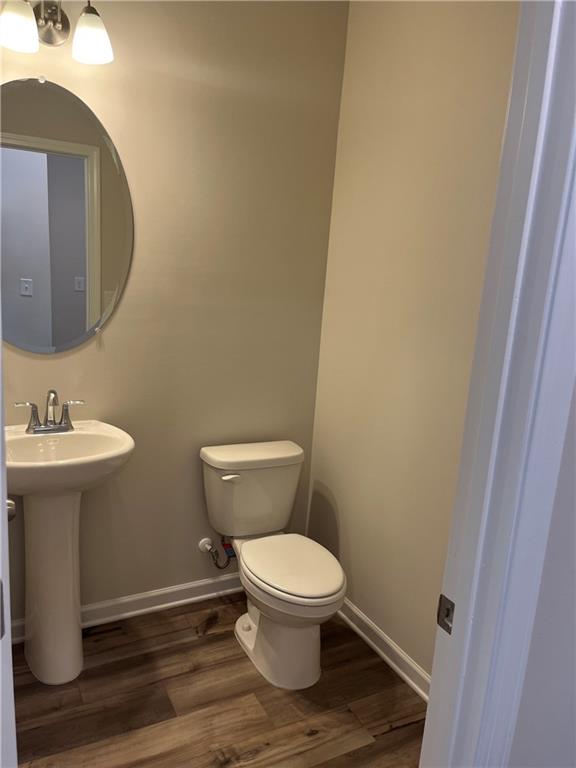 4524 Ajo Walk Atlanta, GA 30331 - Photo 26 of 40 a white toilet sitting next to a bathroom sink