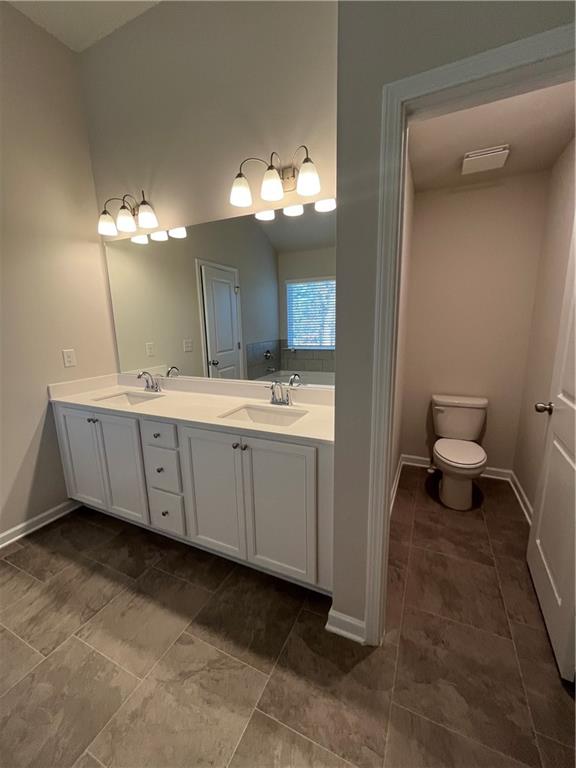 4524 Ajo Walk Atlanta, GA 30331 - Photo 34 of 40 a bathroom with a sink and a mirror