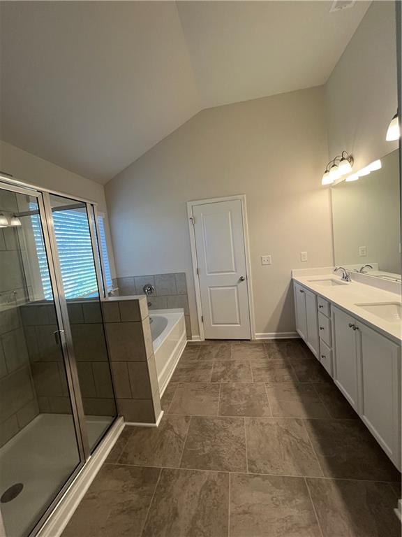 4524 Ajo Walk Atlanta, GA 30331 - Photo 36 of 40 a bathroom with a double vanity sink a mirror and a shower