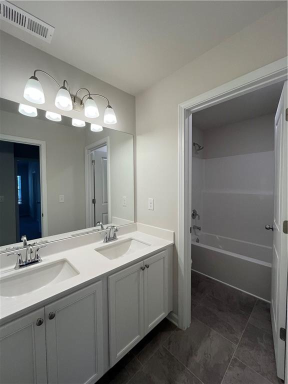 4524 Ajo Walk Atlanta, GA 30331 - Photo 39 of 40 a bathroom with a double vanity sink and a mirror