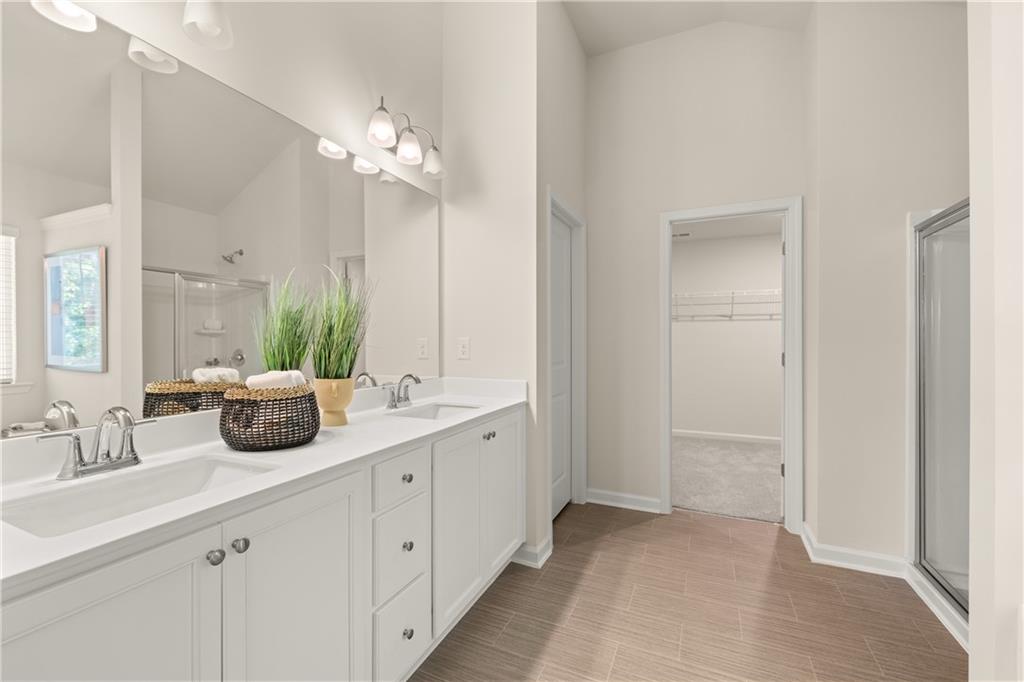4524 Ajo Walk Atlanta, GA 30331 - Photo 5 of 40 a bathroom with a double vanity sink and a mirror