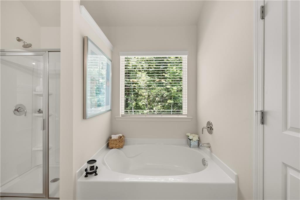 4524 Ajo Walk Atlanta, GA 30331 - Photo 6 of 40 a white bath tub sitting next to a window