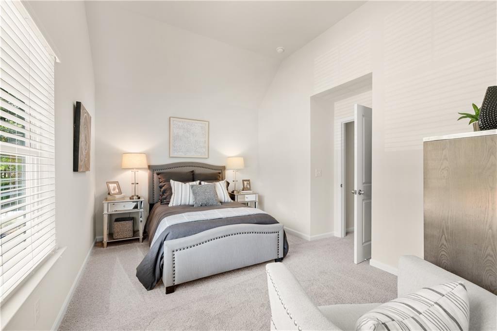 4524 Ajo Walk Atlanta, GA 30331 - Photo 7 of 40 a bedroom with a bed and a couch