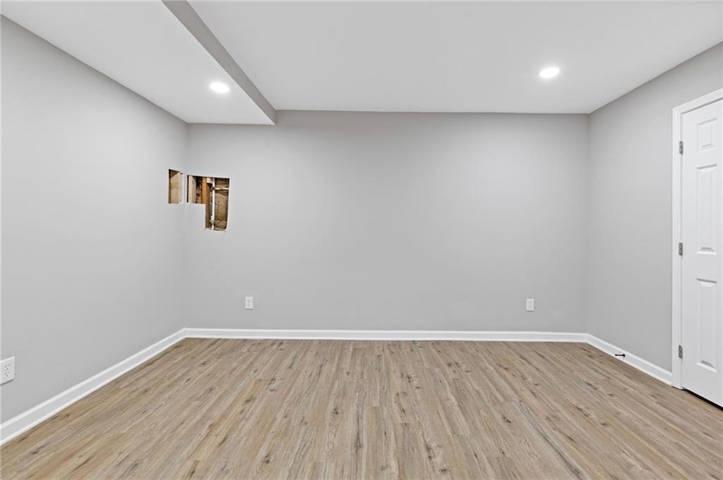 2224 Hudson Drive Southwest Lilburn, GA 30047 - Photo 24 of 31 a view of room with wooden floor