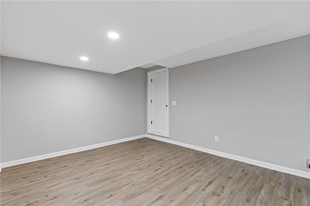 2224 Hudson Drive Southwest Lilburn, GA 30047 - Photo 26 of 31 a view of room with wooden floor and window