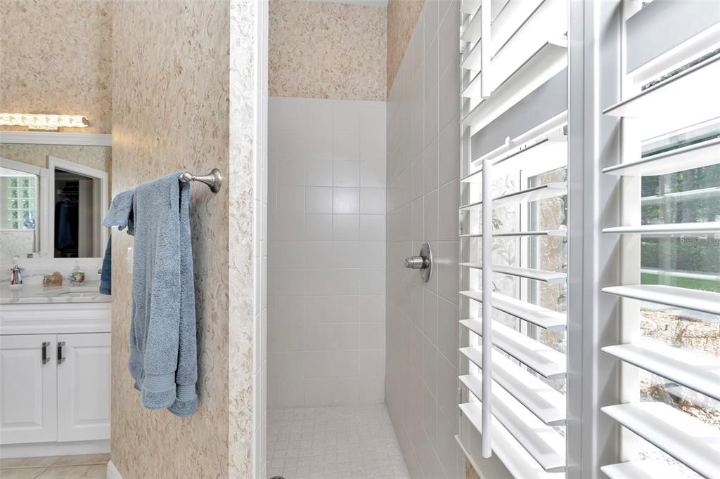 1989 Northwest 111th Loop Ocala, FL 34475 - Photo 24 of 55 a bathroom with a shower and a sink