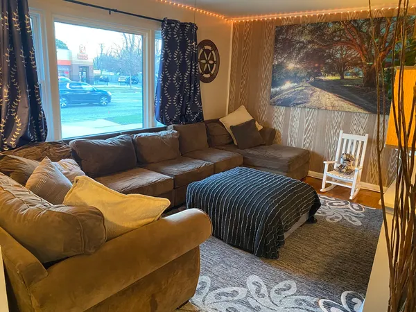 a living room with furniture and a window