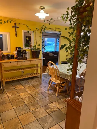 a view of a chairs and table in a patio
