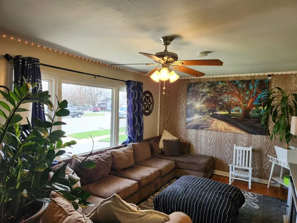 a living room with furniture and a large window