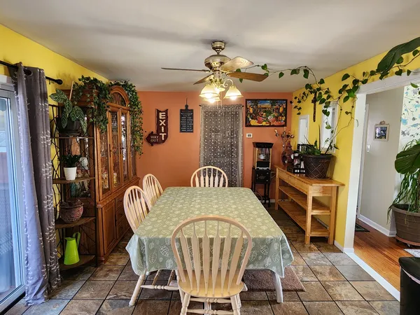 a view of a dining room with furniture and chandelier