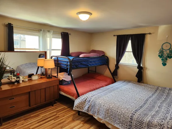 a bedroom with furniture and window