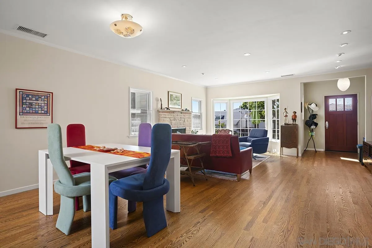4329 Arista Street San Diego, CA 92103 - Photo 12 of 44 a view of a dining room with furniture window and wooden floor
