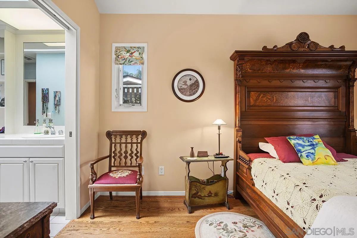 4329 Arista Street San Diego, CA 92103 - Photo 22 of 44 a bedroom with a bed and cabinets