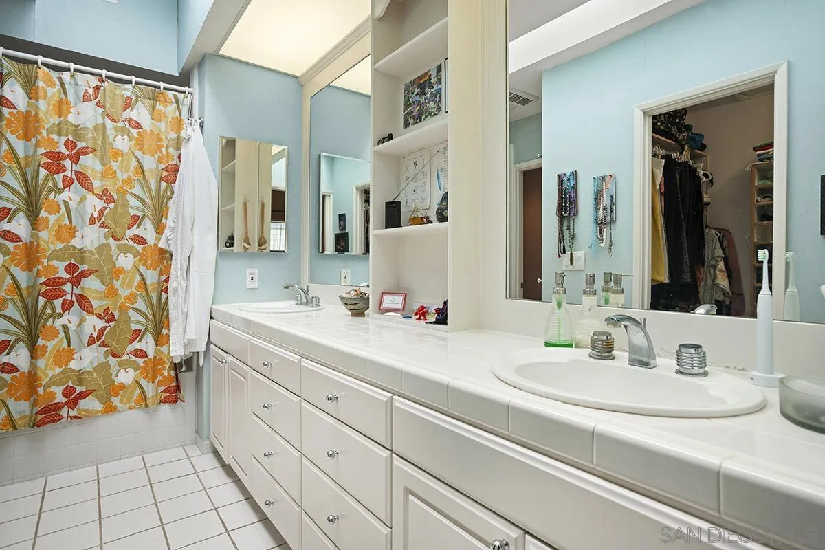 4329 Arista Street San Diego, CA 92103 - Photo 23 of 44 a bathroom with a sink and a mirror
