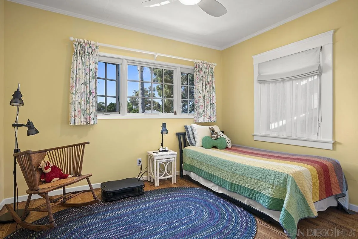 4329 Arista Street San Diego, CA 92103 - Photo 26 of 44 a bedroom with a bed and wooden floor