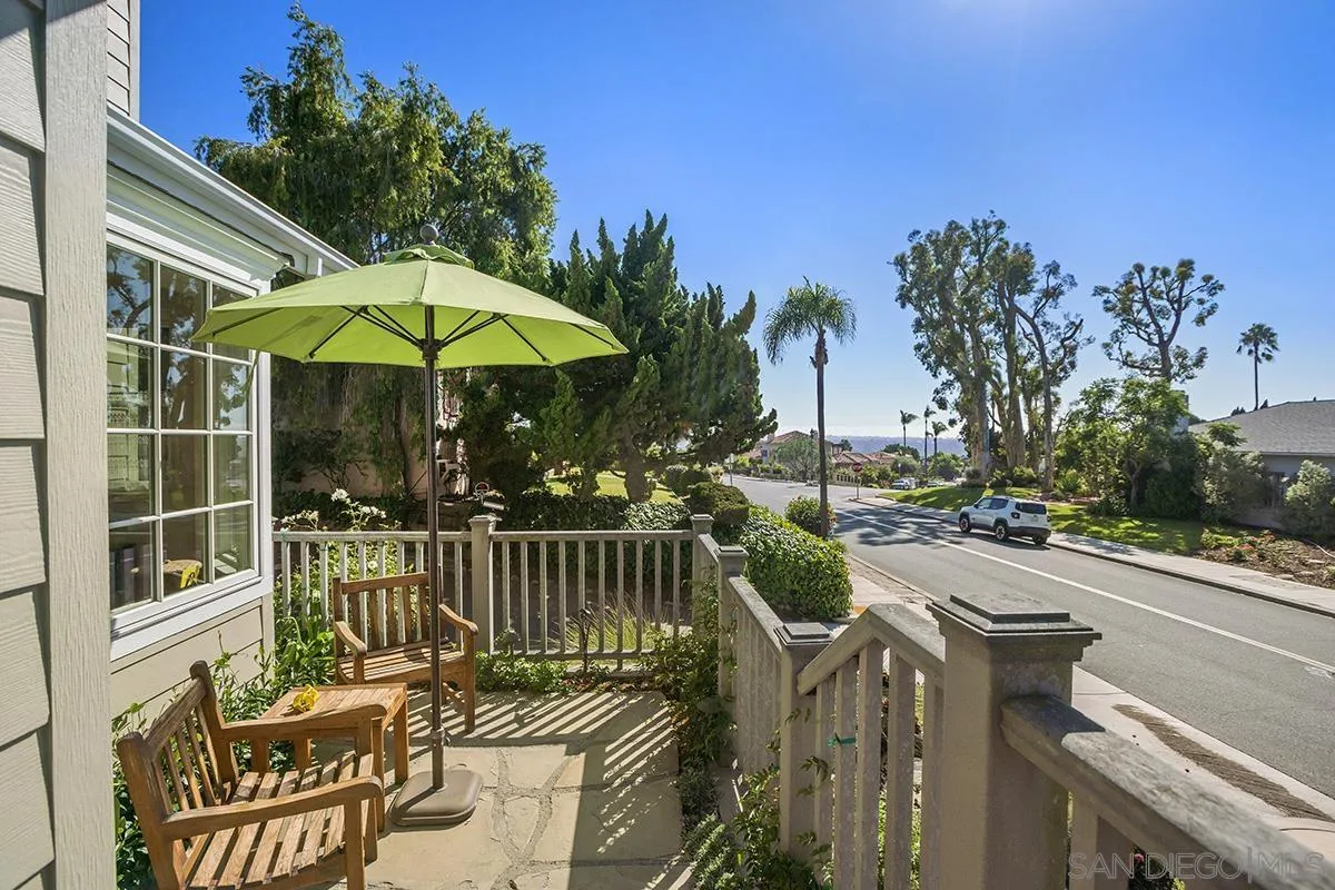 4329 Arista Street San Diego, CA 92103 - Photo 3 of 44 a view of a patio with couches table and chairs under an umbrella