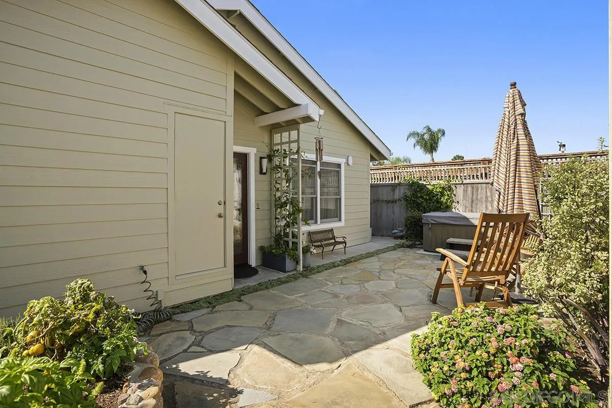 4329 Arista Street San Diego, CA 92103 - Photo 32 of 44 a view of a patio with table and chairs and potted plants