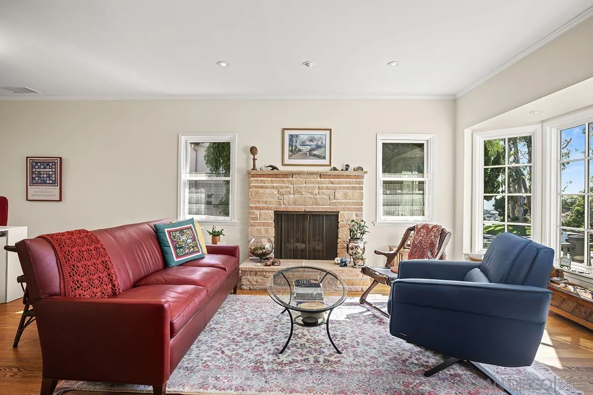 4329 Arista Street San Diego, CA 92103 - Photo 4 of 44 a living room with furniture a rug a fireplace and a large window