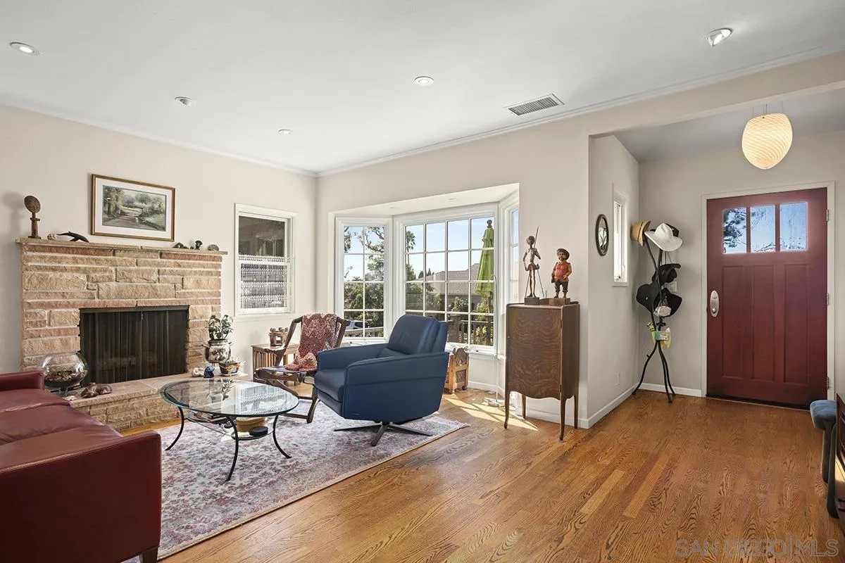 4329 Arista Street San Diego, CA 92103 - Photo 5 of 44 a living room with furniture and a fireplace