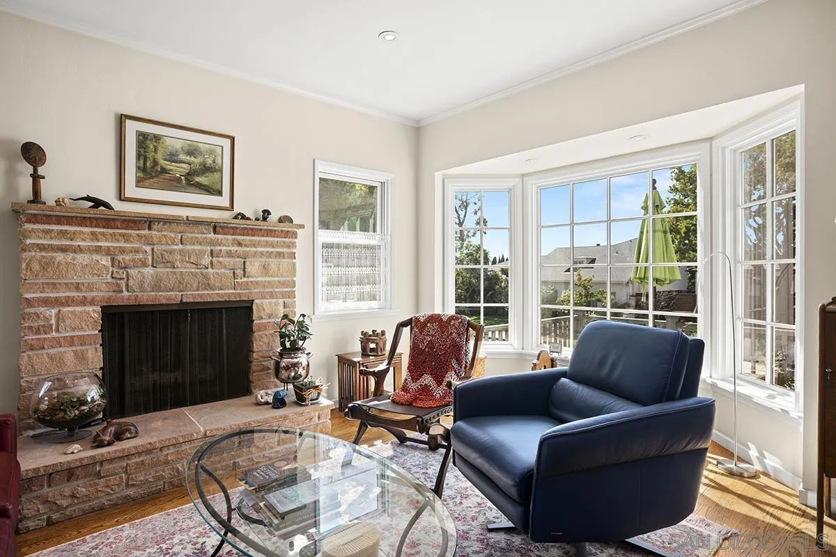 4329 Arista Street San Diego, CA 92103 - Photo 6 of 44 a living room with furniture and a fireplace