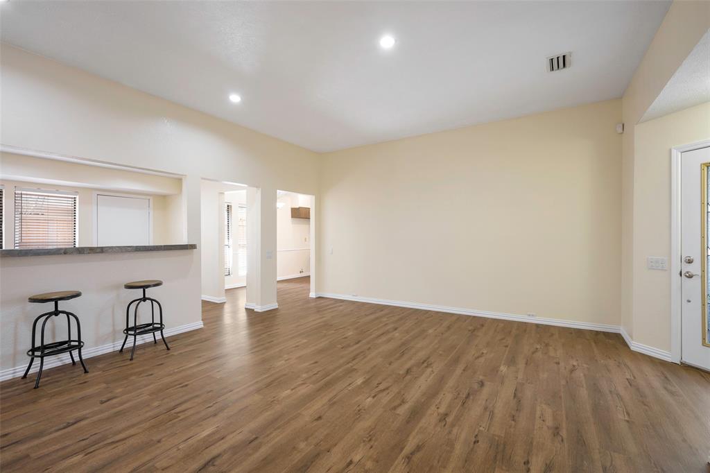 6512 Mc Cormick Ranch Court Plano, TX 75023 - Photo 11 of 29 a view of an empty room with wooden floor and a window
