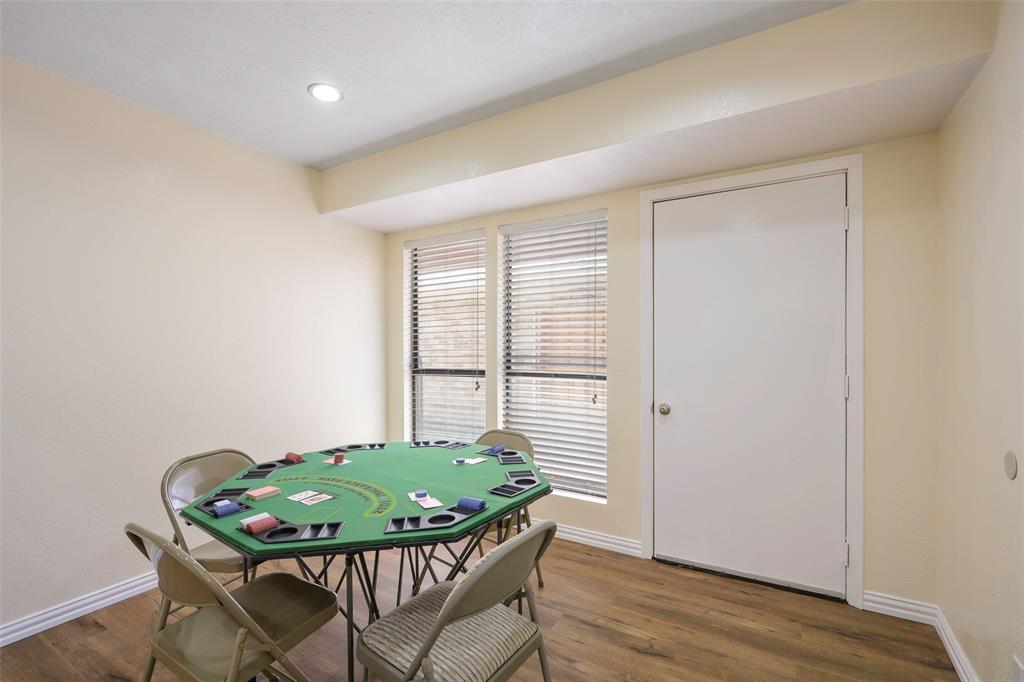 6512 Mc Cormick Ranch Court Plano, TX 75023 - Photo 12 of 29 a view of a dining room with furniture and wooden floor