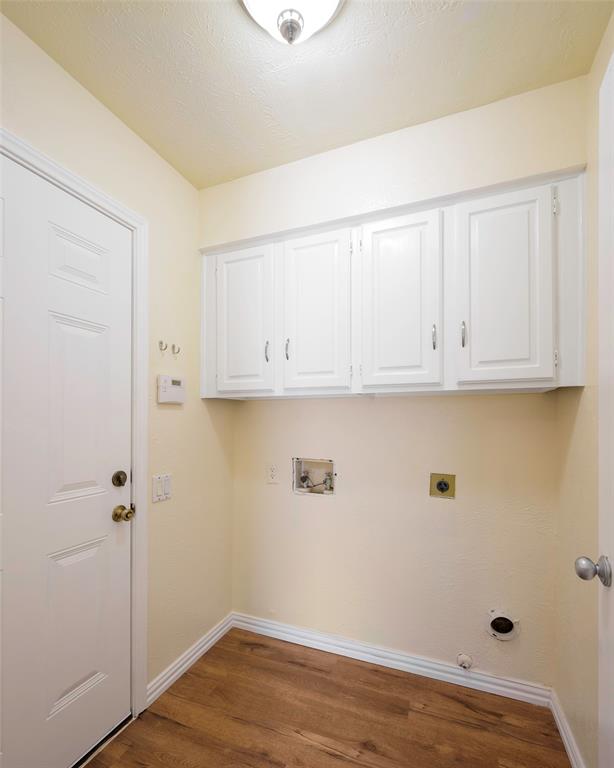 6512 Mc Cormick Ranch Court Plano, TX 75023 - Photo 17 of 29 a view of cabinets and wooden floor