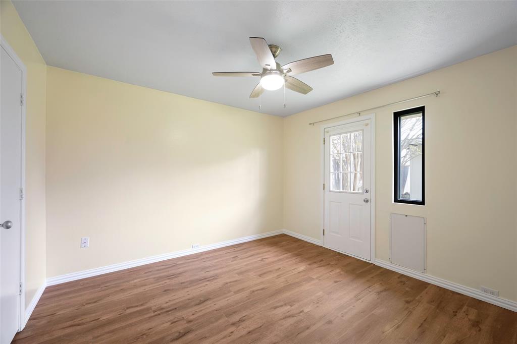 6512 Mc Cormick Ranch Court Plano, TX 75023 - Photo 20 of 29 a view of a big room with wooden floor and windows in a room