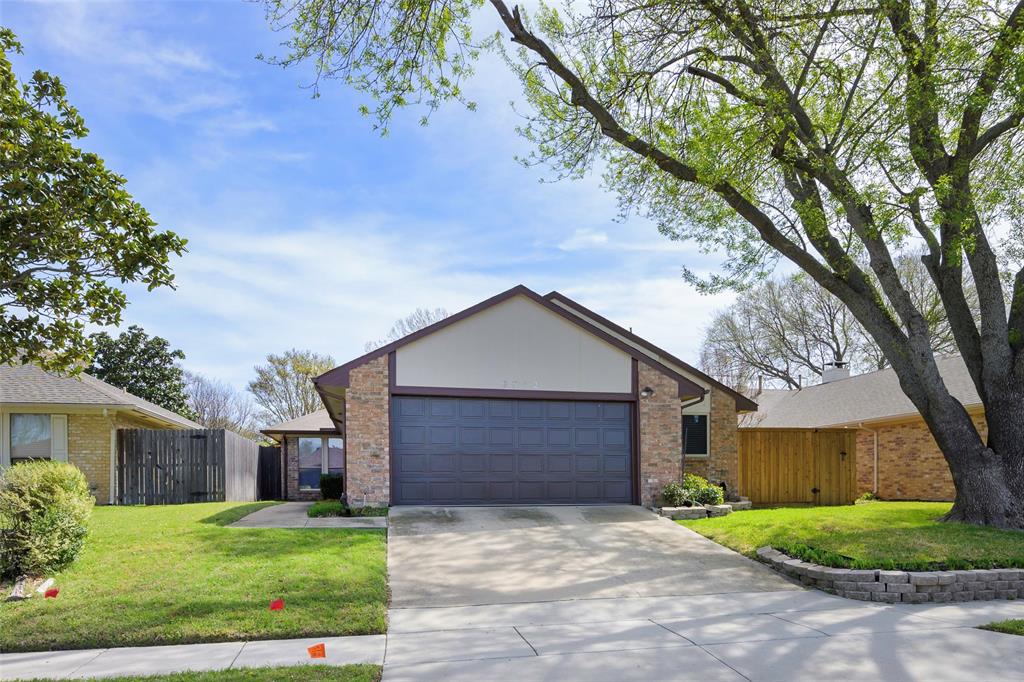 6512 Mc Cormick Ranch Court Plano, TX 75023 - Photo 2 of 29 a front view of a house with a yard and garage
